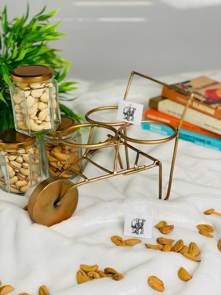 Metal rickshaw with three jars
